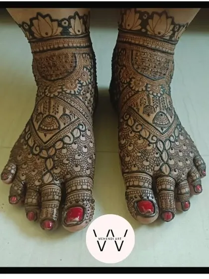 A beautiful bridal feet design with intricate details and a lotus cuff.