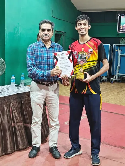 Our champion Deepit Patil receives his trophy for securing first place in the Men's category at the 2nd District Ranking tournament.