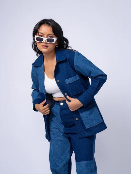 This pose highlights the cool, modern aesthetic of the brand. The makeup is barely there, focusing on great skin and a neutral lip.