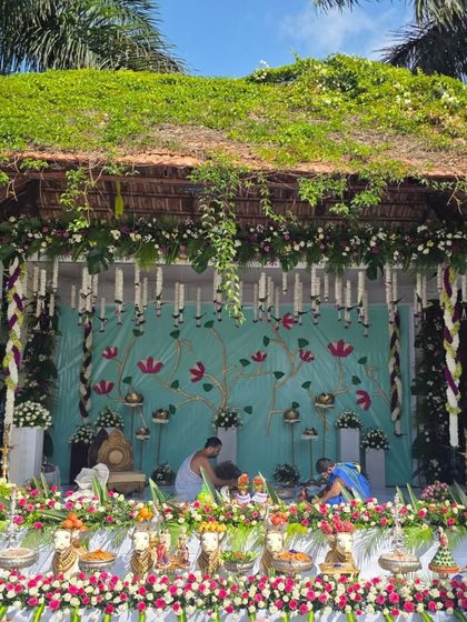 Another view of the serene outdoor naming ceremony, showing the priests performing the rituals.