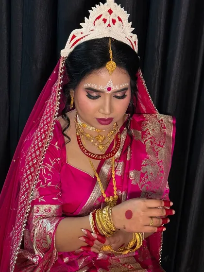 I have a special place in my heart for traditional Bengali bridal makeup. From the intricate chandan art to the bold eyes that complement the mukut, I create an authentic and graceful look that honors your heritage.