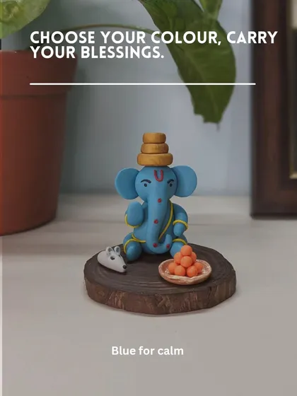 A beautiful blue Ganesha for calm. This serene idol sits peacefully with his offerings, designed to create a tranquil atmosphere wherever you place it.