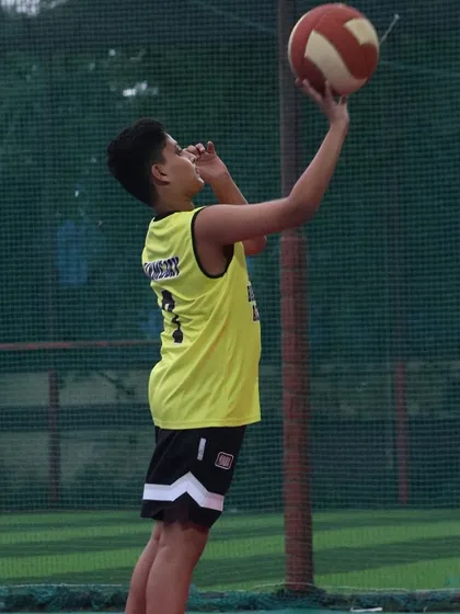 A young player practices his layup form. We focus on perfecting the fundamentals to build a solid foundation for every athlete.