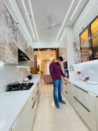 A detailed look at a completed kitchen in ATS Nobility. This parallel kitchen features textured marble-finish upper cabinets and white lower cabinets, creating a unique and luxurious feel.