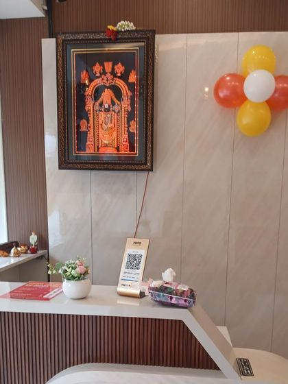 The billing and reception counter is a key part of any commercial space. We designed this one to be clean and efficient, with simple wood-textured paneling and a small decorative plant to make it feel welcoming.