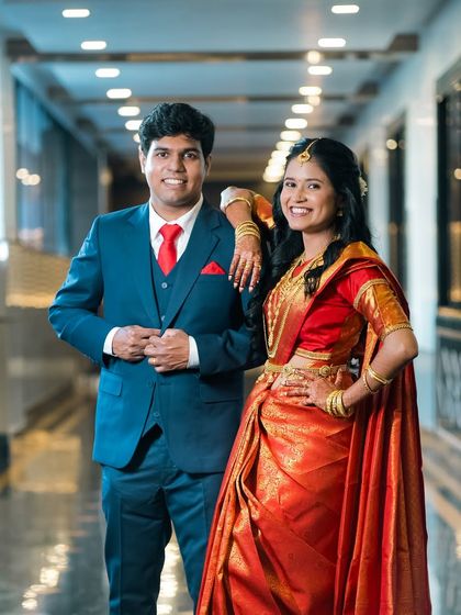 A stylish portrait of the couple. The fusion of a traditional saree with a modern suit creates a unique and powerful look for their pre-wedding photos.