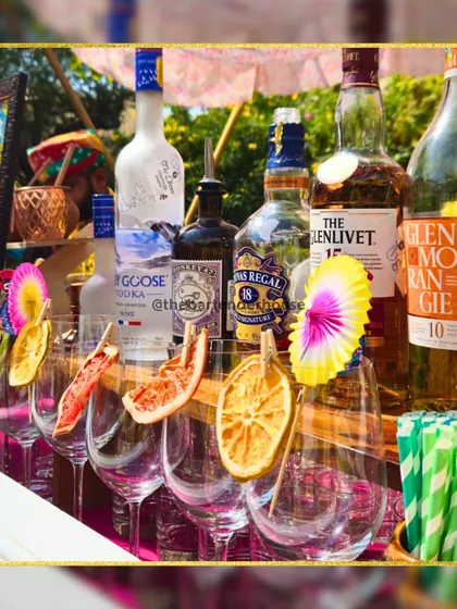 This minimalist bar setup features a lineup of premium spirits and elegant glassware, ready for a sophisticated event. Sometimes, simplicity is the ultimate luxury.