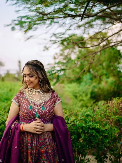 My bride's Mehendi look is pure bliss. This offbeat, colorful outfit is paired with a soft glam makeup look that is modern and chic.