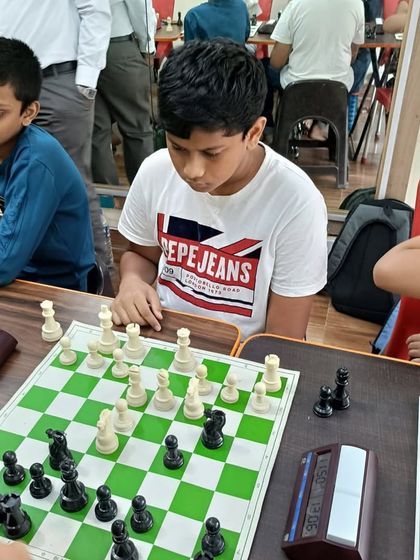 Deep in concentration during a chess competition at our academy. I encourage healthy competition to help students apply the strategic thinking and focus they develop in class.