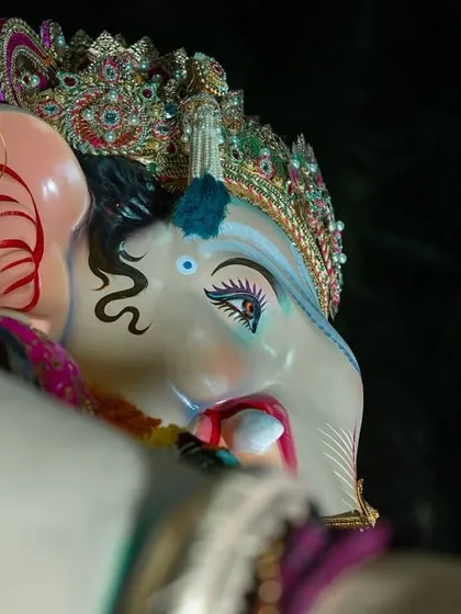 A side-profile close-up of the Sanpadya Cha Maharaja, highlighting the elegant curves and adornments.