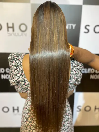 A close-up look at the glossy shine achieved with our hair botox and highlights combination treatment. The hair looks and feels incredibly healthy.