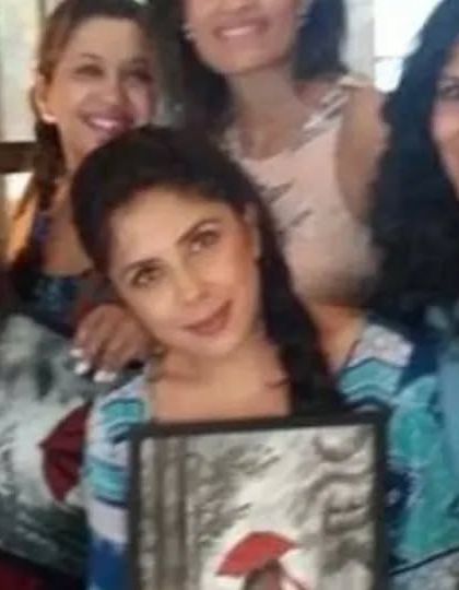 A group of friends smiling with their finished paintings. The best part of my job is seeing people connect and create happy memories together.