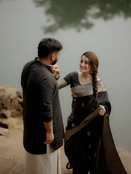 A gentle, playful interaction by the water's edge. I focus on capturing the subtle gestures that reveal a couple's unique bond during their pre-wedding shoot.