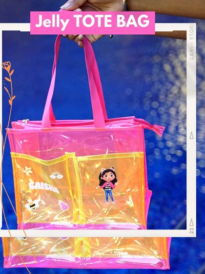 Our jelly tote bag in a vibrant pink and yellow design. This spacious bag is customized with the name 'Saisha' and character patches, perfect for carrying everyday essentials in style.