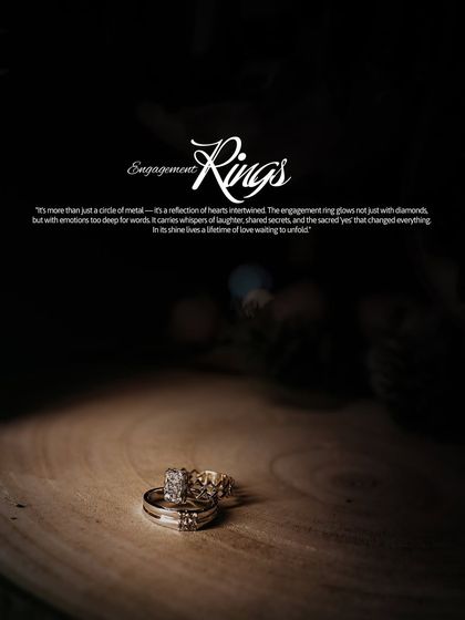A dramatic and beautifully lit shot of the engagement rings, presented as a piece of art that symbolizes the couple's commitment.