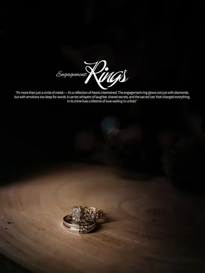 A dramatic and beautifully lit shot of the engagement rings, presented as a piece of art that symbolizes the couple's commitment.