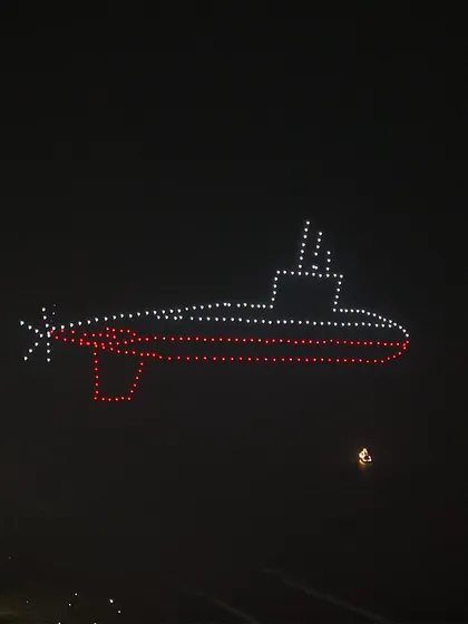 An aerial submarine formation created for our Indian Navy Day show. This display honored the silent guardians of our deep seas, showcasing their strength and strategic importance through light.