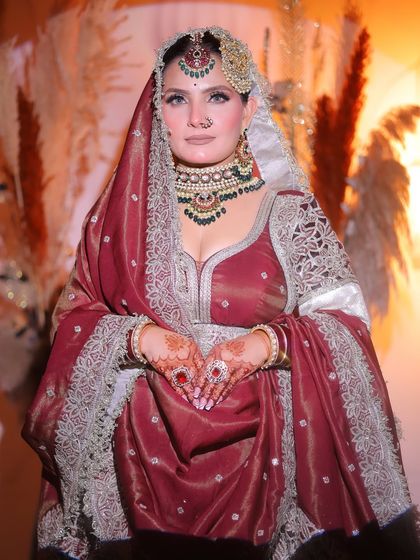 The bride looking every bit a queen. The makeup is powerful yet elegant, designed to make a lasting impression.