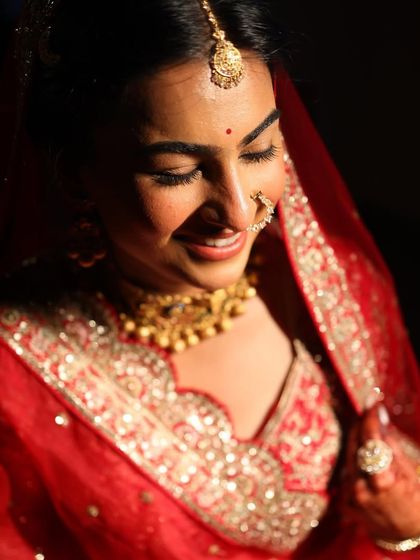 A close-up shot capturing the soft glam and happy glow of a bride on her special day.