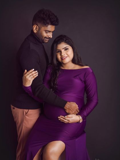 The deep purple gown looks so regal in this couple's portrait. We posed them to create a sense of intimacy and shared anticipation.