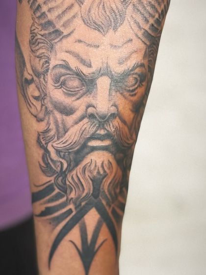 The full view of the forearm tattoo, showing how the design is composed to fit the arm perfectly.