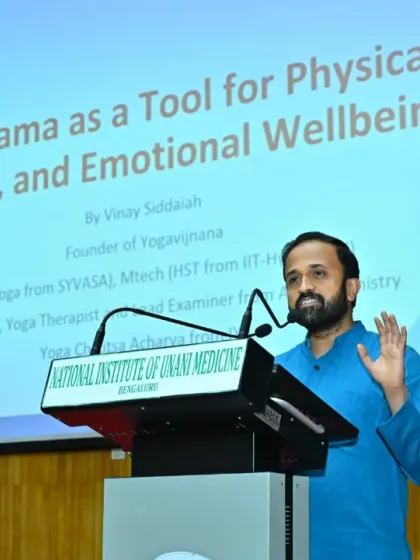 Presenting at Yoga Sangam on "Pranayama as a Tool for Physical, Mental, and Emotional Wellbeing." My talks and webinars aim to educate teams on the scientific principles behind yoga, empowering them with knowledge for lasting health.
