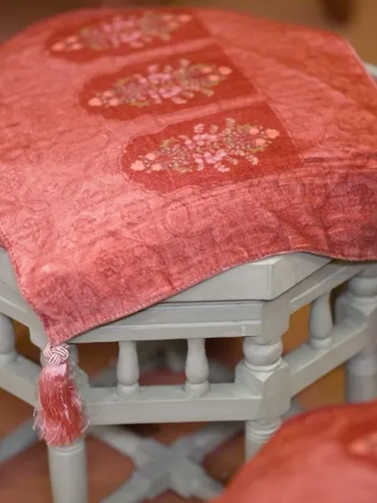 For the priest seating, the brief was to use peaches, greens, and rusts with Indian carvings. I chose a calming mint green wood polish and adorned the seats with heritage motifs to honor the sacred moments of the havan.