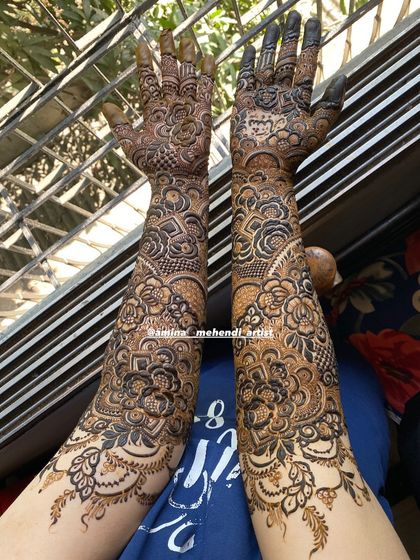 The same design from a different angle, showing the beautiful floral patterns on the lower part of the arms.