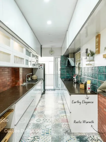 The transformed galley kitchen, featuring rustic brick, elegant green tiles, and vibrant Moroccan floor tiles.