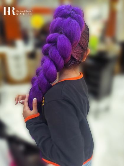 A side view of the high-ponytail purple braid, showing the intricate weaving and vibrant color.