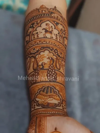 A single arm showcasing a story in bands. This design includes a baraat scene with a groom on a horse, dancing peacocks, and other festive elements.