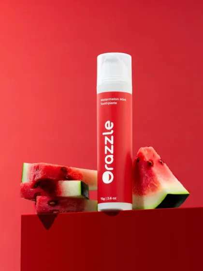 A vibrant, ingredient-focused shot for a watermelon mint toothpaste. We used a monochromatic red setup with fresh watermelon slices to create a bold, eye-catching image that communicates the flavor.