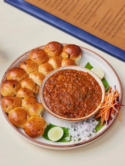 Our version of Pav Bhaji, a beloved street food classic, elevated for a dining experience. The rich, slow-cooked vegetable mash is served with soft, buttery mini pavs, a guaranteed crowd-pleaser.