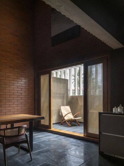 A bedroom in the Brick House opens onto a private balcony, demonstrating our approach of creating intimate, cocooned spaces that still maintain a strong connection to the outdoors.