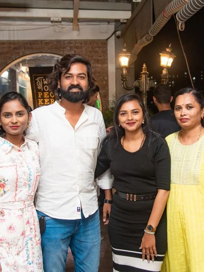 The same group of friends, captured again. They were having such a good time, one photo wasn't enough.