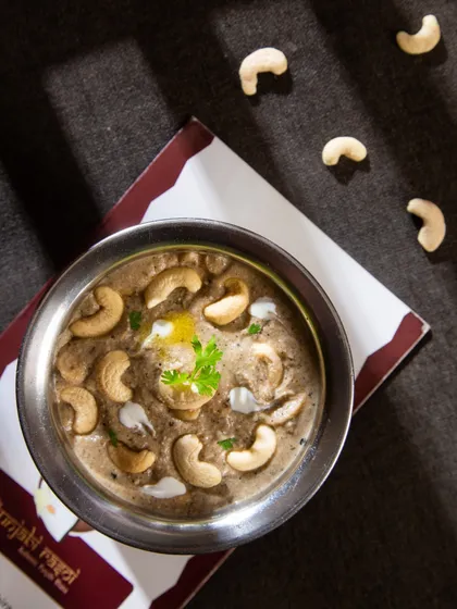 For a truly rich and royal dish, try our Kaju Masala. It's a creamy, nutty curry that is pure indulgence in every spoonful.