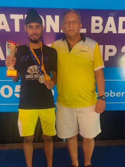 **A National Champion's Pride.** National Champion Ishmeet Singh with his medals and trophy, a result of countless hours of dedicated training and coaching.