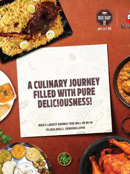 A delicious spread from our Empire restaurant, featuring their famous biryani, chicken dishes, and fresh juices, offering a feast for hungry travelers.