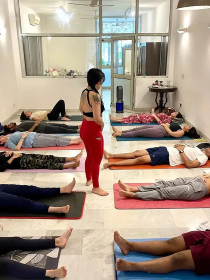 The end of a powerful breathwork workshop. Participants lie in Savasana, integrating the experience and allowing the body and nervous system to rest and reset.