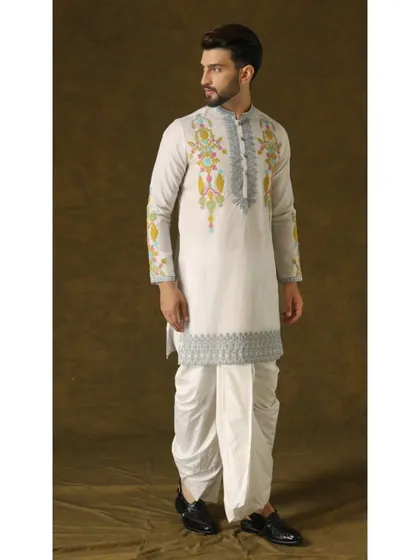 A side profile of the Narayan Nirvana dhoti set, emphasizing the unique silhouette and the beautiful drape of the organza fabric.