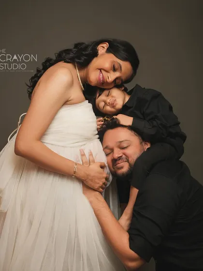 A maternity session is a celebration for the whole family. This tender moment, with their first child and dad listening to the baby bump, is a beautiful story of love expanding to welcome a new life.