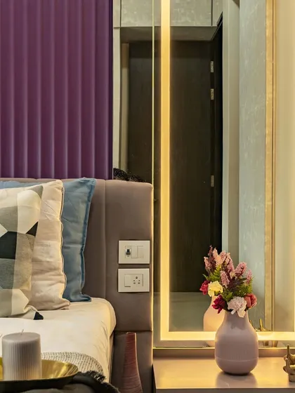 A close-up of the dressing area in this master bedroom. The full-length mirror is framed with integrated LED lighting, providing perfect illumination while adding a touch of glamour.