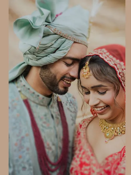 Pure, uninhibited laughter between the bride and groom. We live for these candid moments that show the true friendship and joy at the heart of their relationship.
