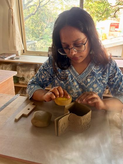 I'm thrilled to introduce Asmi, a former student who is now our studio apprentice and instructor for our Clay Dates. It's wonderful to see our community members grow into teaching roles.