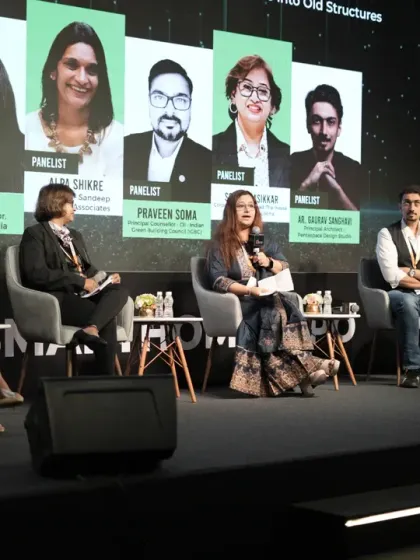 The full panel for "The Smart Retrofit" session, bringing together a diverse group of experts from architecture, design, and technology.