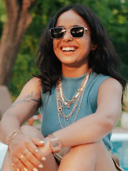 A sunny, smiling shot by the pool. This shows a more relaxed, "gangsta Bappi Lahiri" vibe, proving that my style can range from dark and edgy to bright and playful.