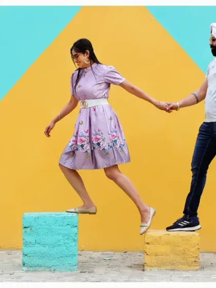 A creative and modern pre-wedding shot using colorful blocks as steps. This symbolizes the couple taking the next steps in their journey together in a fun and artistic way.