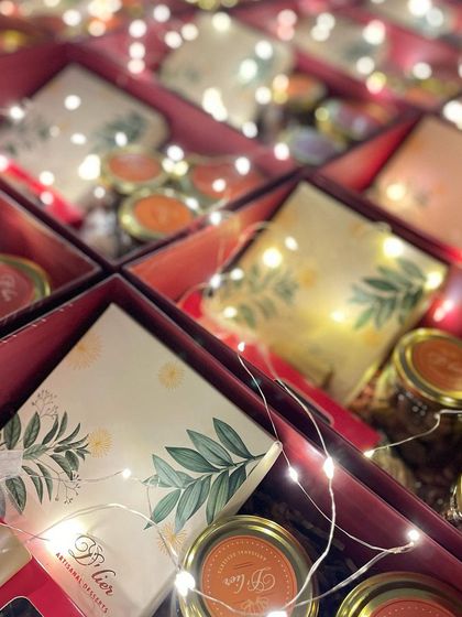 Our large red Diwali hampers, filled to the brim and illuminated with festive lights, ready to be sent out.