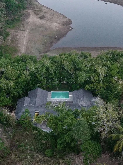 This aerial view of The Leaf Poomala in Kerala shows how we integrate our designs into the landscape. The hospitality project sits lightly on the land, nestled within the forest and overlooking a reservoir, offering guests an immersive natural retreat.