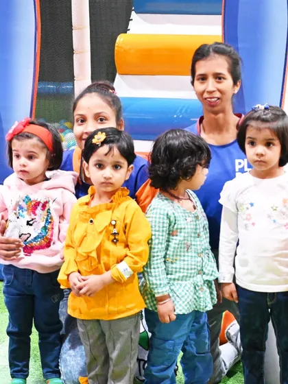 An instructor poses with a group of toddlers from a visiting school. I provide close supervision and age-appropriate activities to ensure even my youngest visitors are safe and happy.